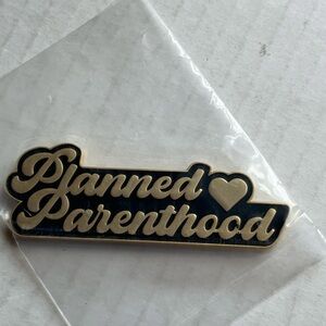 Gold and Black Planned Parenthood Pin